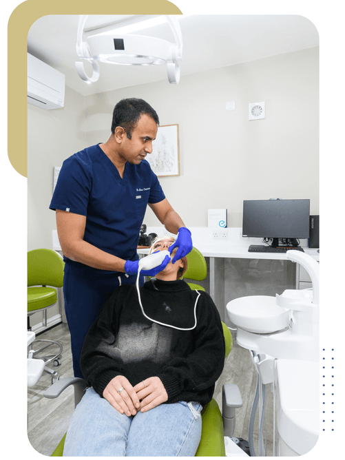 Dentist performing Invisalign 3D scan